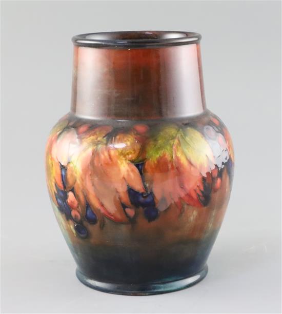 A Moorcroft leaf and berry flambe vase, 1930s, H.21cm
